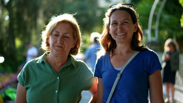 istock Mother and daughter together outside 1366328818