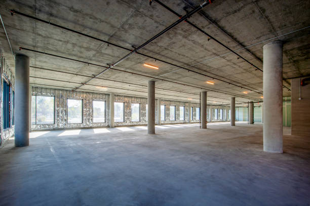 Empty unimproved office space Empty space in a reinforced concrete building. reinforced concrete stock pictures, royalty-free photos & images