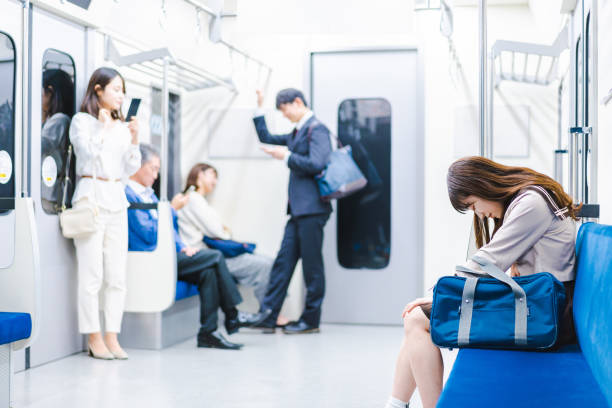School girl suffering from stomachache on a train