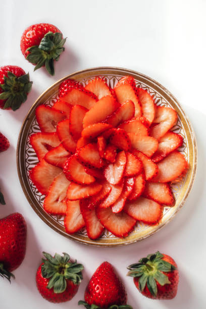 istock sliced strawberries in a rose design 1366332618