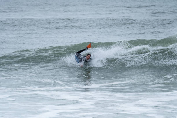 istock Bodyboarder performing a 360 trick 1366339706