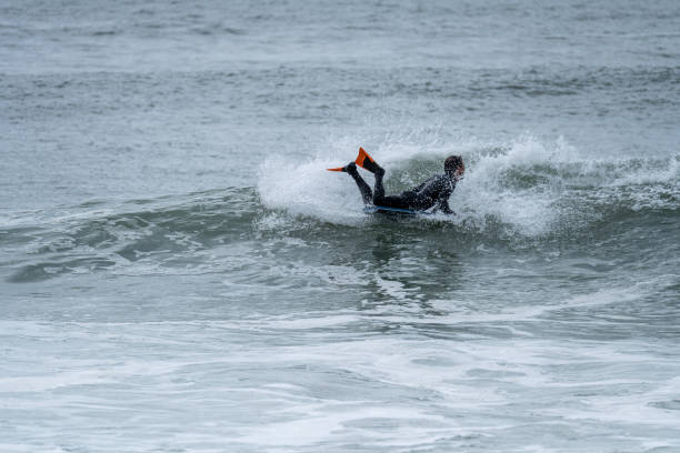 istock Bodyboarder performing a 360 trick 1366339711