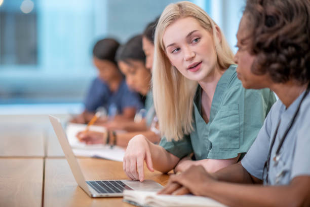 istock Medical students discussing 1366343801