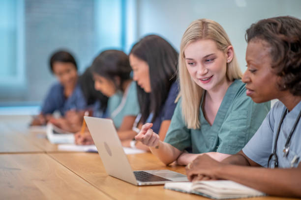 istock Medical students discussing 1366343804