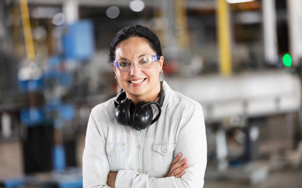istock Hispanic woman working in plastics factory 1366345308