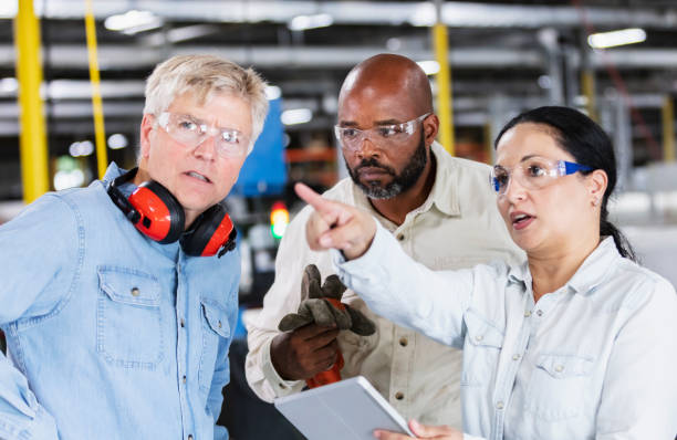 istock Multiracial workers meeting in plastics factory 1366345432