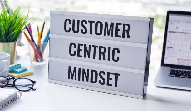 Customer centric mindset text with work table.business service stock photo