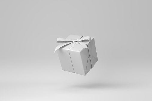 Gift box with ribbon on a white background. minimal concept. monochrome. 3D render.