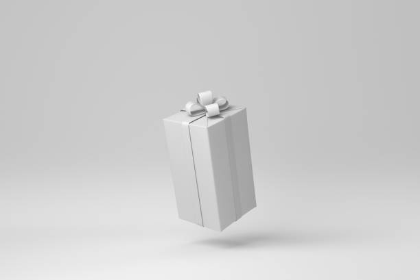 istock Gift box with ribbon on a white background. minimal concept. monochrome. 3D render. 1366351219