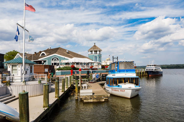 Old Town Alexandria Alexandria, Virginia - July 30, 2021: The waterfront in Old Town Alexandria with restaurants and tour boats docked on the Potomac River on a sunny, summer day watertaxi stock pictures, royalty-free photos & images