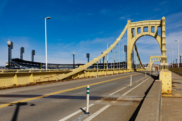 Roberto Clemente Bridge in Pittsburgh Pittsburgh, PA - April 3, 2021: The Roberto Clemente Bridge in downtown Pittsburgh crossing the Allegheny River to the PNC Park baseball stadium, home of the Pittsburgh Pirates sixth street bridge stock pictures, royalty-free photos & images
