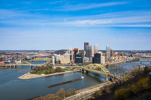 Pittsburgh, PA - April 3, 2021: View of the Pittsburgh skyline from the South Shore, looking onto Point State Park and the confluence of the three rivers - Monongahela, Allegheny and Ohio - on a spring day