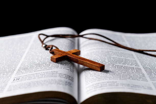 istock Wooden cross and bible on the table 1366351888