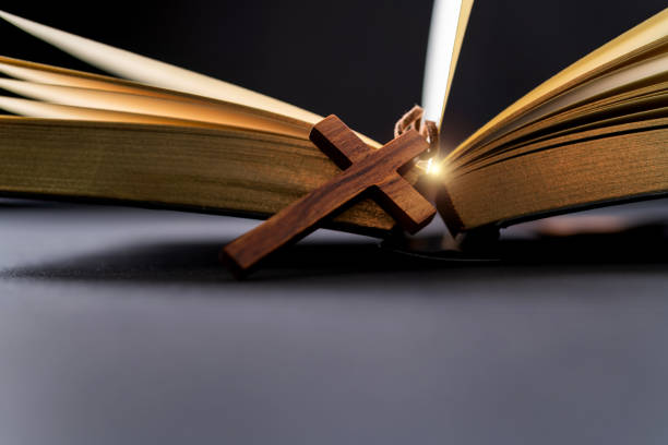 istock Wooden cross and bible on the table 1366351890