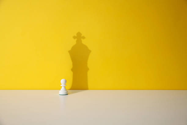 Pawn piece wants to be king Pawn piece wants to be king. pawn chess piece photos stock pictures, royalty-free photos & images
