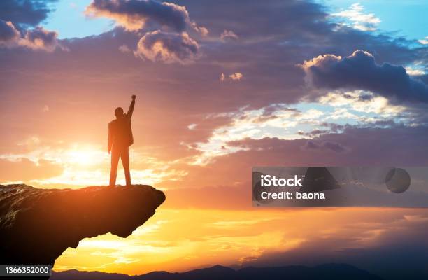 Businessman Standing On The Top Of Rock Stock Photo - Download Image Now - Mountain Peak, On Top Of, In Silhouette