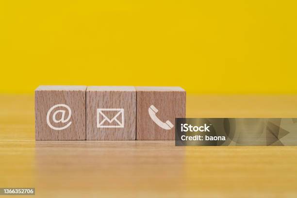 Contact Us Icons On Wooden Block Shapes Stock Photo - Download Image Now - Contact Us, Toy Block, 'at' Symbol
