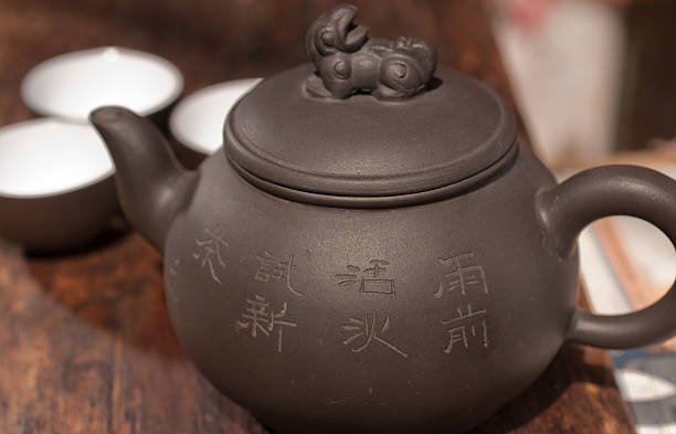 istock chinese green tea pot and cups 136635323
