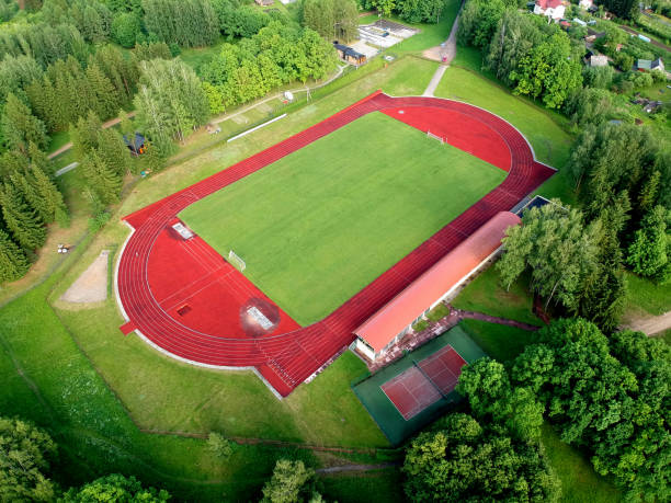 istock Small province stadium in spring, aerial view 1366354215