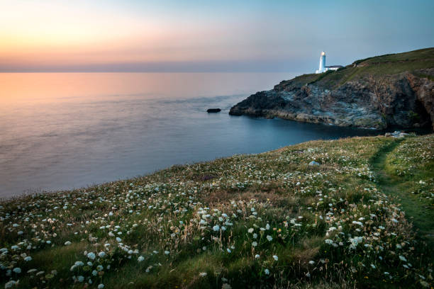 istock Trevose Head lighthouse,shining its' light at dusk, Cornwall,England,United Kingdom. 1366358584