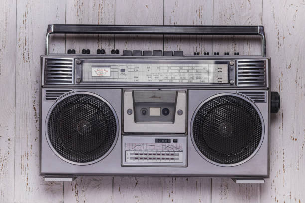 istock Cassette retro tape recorder on a white vintage background 1366360342