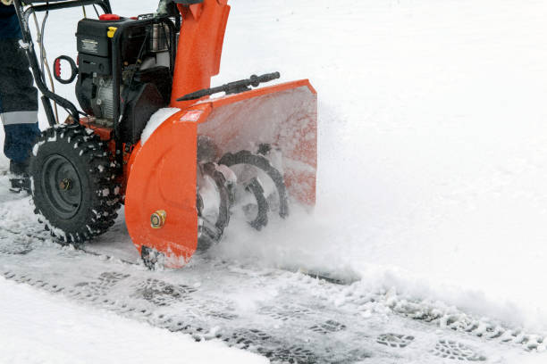 istock A man works with a snow blower to remove freshly fallen snow from a high voltage transformer driveway. 1366360916