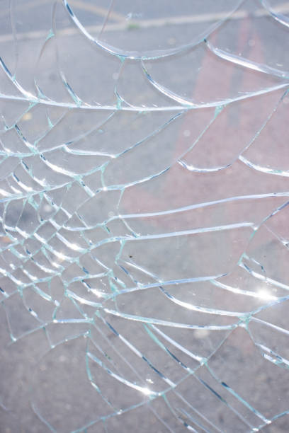 istock Broken glass over natural pale pink background 1366361074