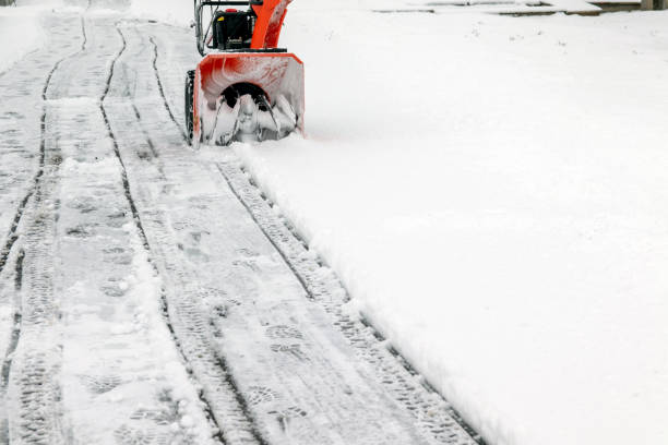 istock A man works with a snow blower to remove freshly fallen snow from a high voltage transformer driveway. 1366361931