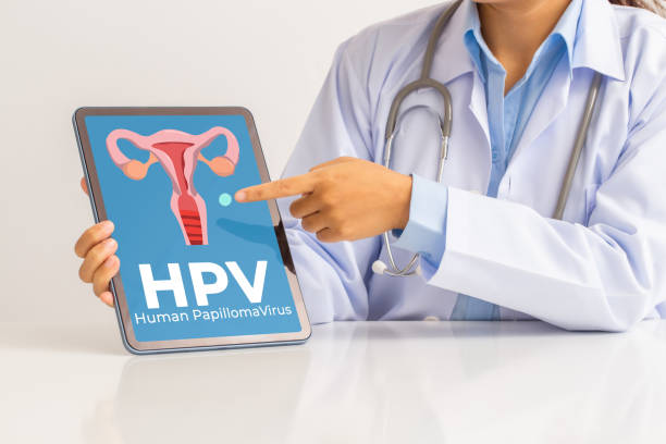 istock HPV (Human Papillomavirus) Female doctor explaining knowledge and pointed out women health problems on tablet screen, viruses Some strains infect genitals and can cause cervical cancer. 1366366005