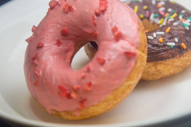 istock Strawberry and chocolate donuts on plate 1366366805