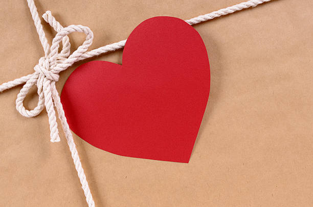 istock Brown paper package with valentine card 136637094