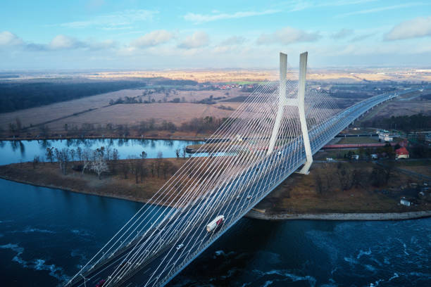 istock Large bridge over river with cars traffic 1366371922