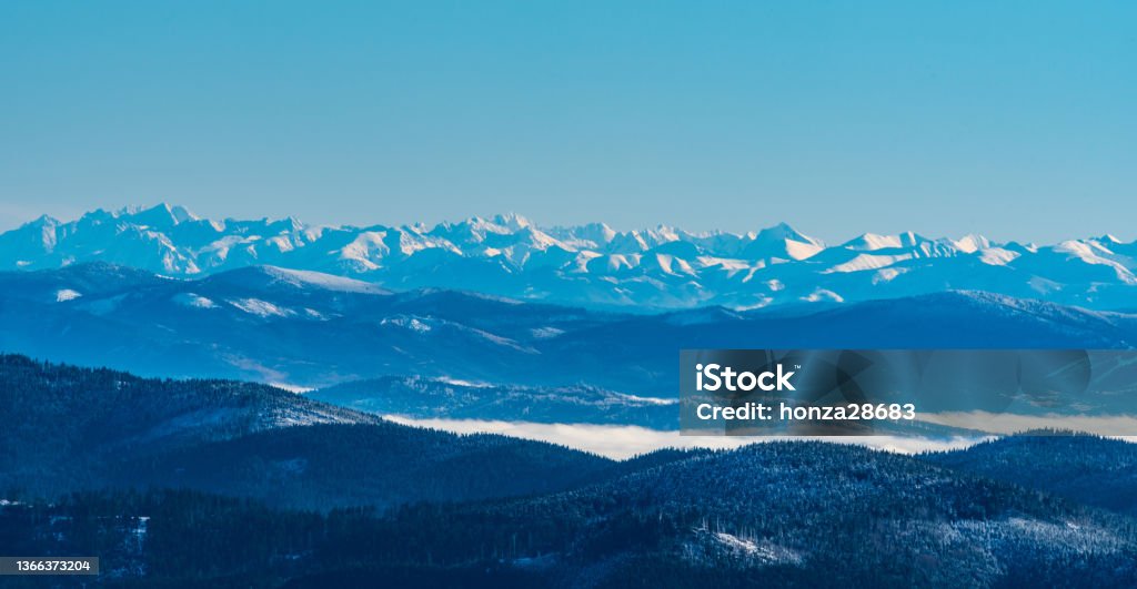 High Tatras and easternmost part of Western Tatras from Lysa hora hill in winter Moravskoslezske Beskydy mountains in Czech republic Amazing view to High Tatras and easternmost part of Western Tatras from Lysa hora hill in winter Moravskoslezske Beskydy mountains in Czech republic Beauty In Nature Stock Photo