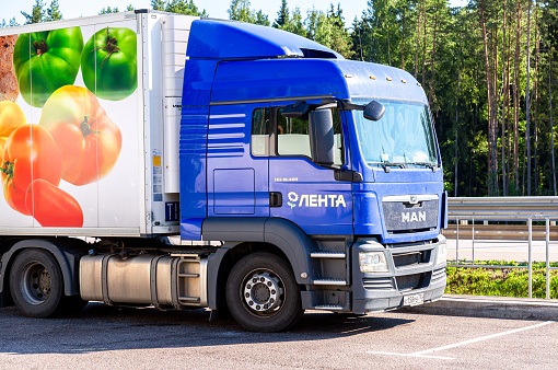 Moscow, Russia - July 6, 2021: MAN truck of grocery Lenta store. Freight delivery truck on a highway