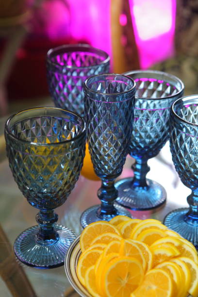 istock Sliced lemons and blue glass goblets 1366374125
