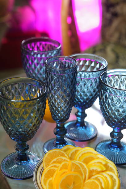 istock Sliced lemons and blue glass goblets 1366374129