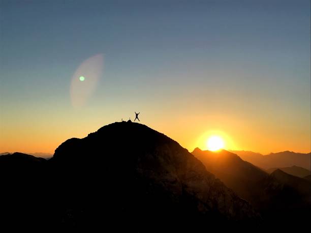 istock jump on the mountain top 1366374130
