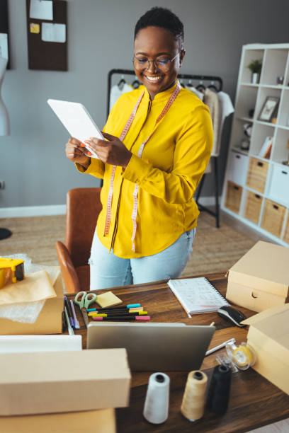 istock Working woman at online shop. 1366375962