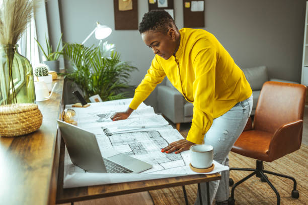 istock Female architect working at home during the day. 1366377335