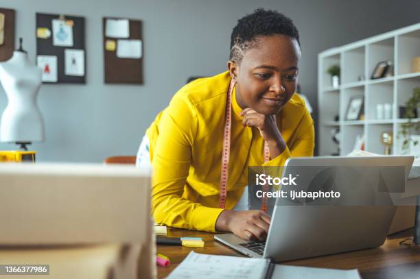 Businesswoman Working On Laptop In Office Stock Photo - Download Image Now - Office, Business, Dating