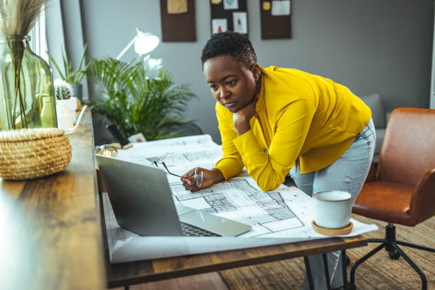 istock Female architect working at home 1366379284