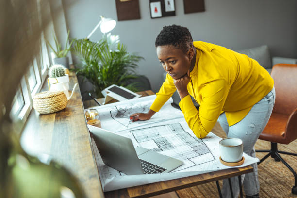 istock Female architect working at home 1366379423