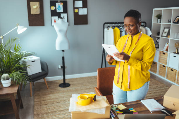 istock Working woman at online shop. 1366379462