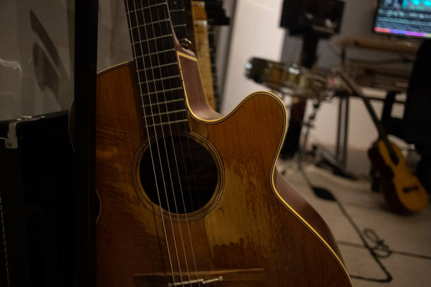 istock Acoustic guitar in a music studio 1366380417