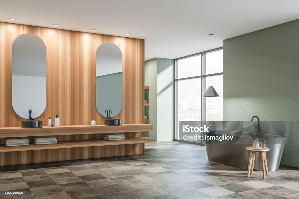 Corner view on dark bathroom interior with two sinks, bathtub Corner view on dark bathroom interior with two sinks, bathtub, mirror, panoramic window with town view, green walls, towels and liquid soap. Concept of hygienic and spa procedures. 3d rendering Bathroom Stock Photo