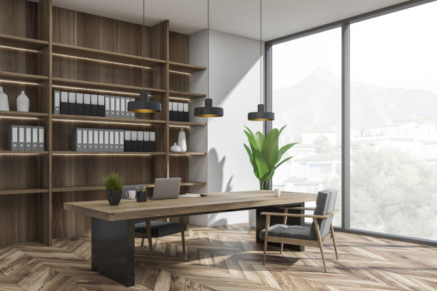 istock Bright office room interior with desk, two comfortable armchairs 1366382145