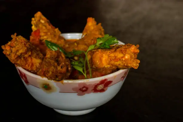 Photo of A very popular Bengali pron gravy dish Chingri Macher Malai Curry made with coconut milk.