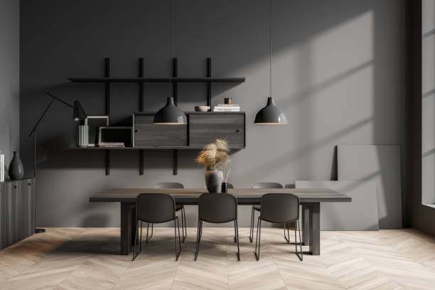 istock Dark dining room interior with six chairs, table, lamp, shelves 1366383333