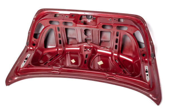 istock Red metallic boot lid reverse side with stiffeners on a white isolated background in a photo studio with a nameplate for installation on a car after an accident. Spare part for body repair 1366384434