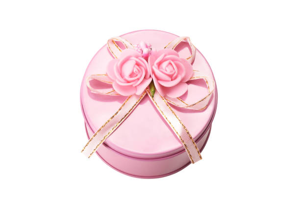 Gift box with ribbon and rose shape ornaments (Clipping Path) isolated on the white background